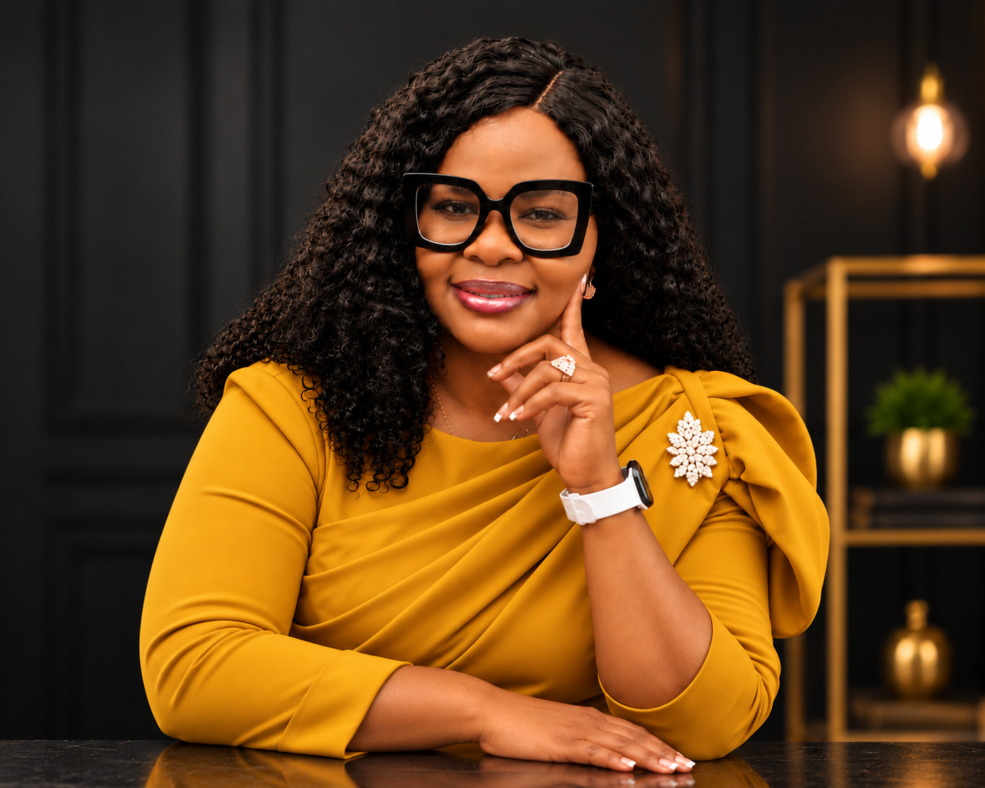 Dr. Tessy Aguzie wearing a gold dress