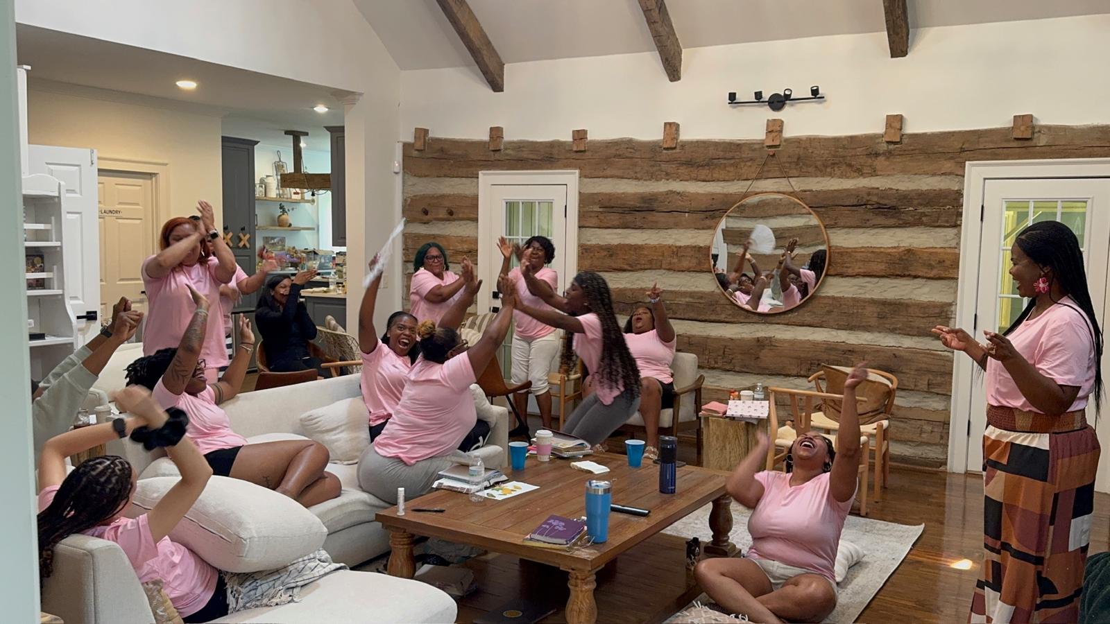 Women worshipping together at the R.I.S.E. Women's Retreat